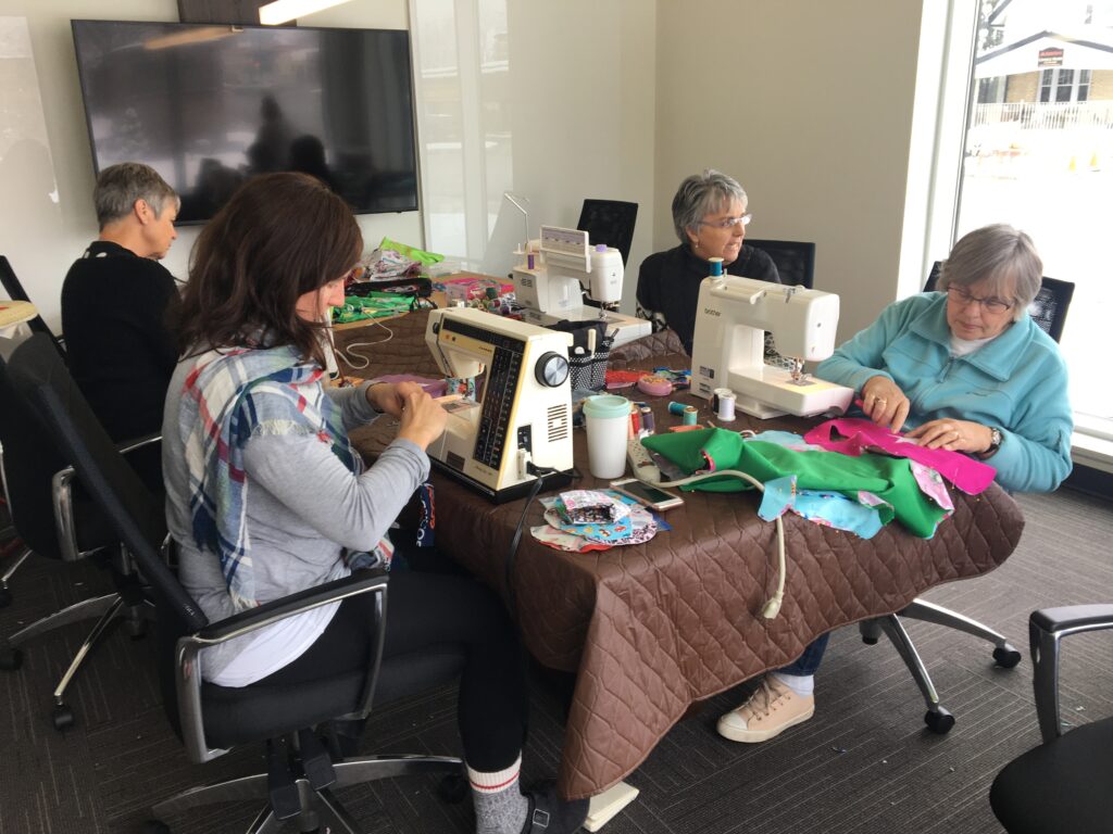 Sewing caps and masks for children in hospital
