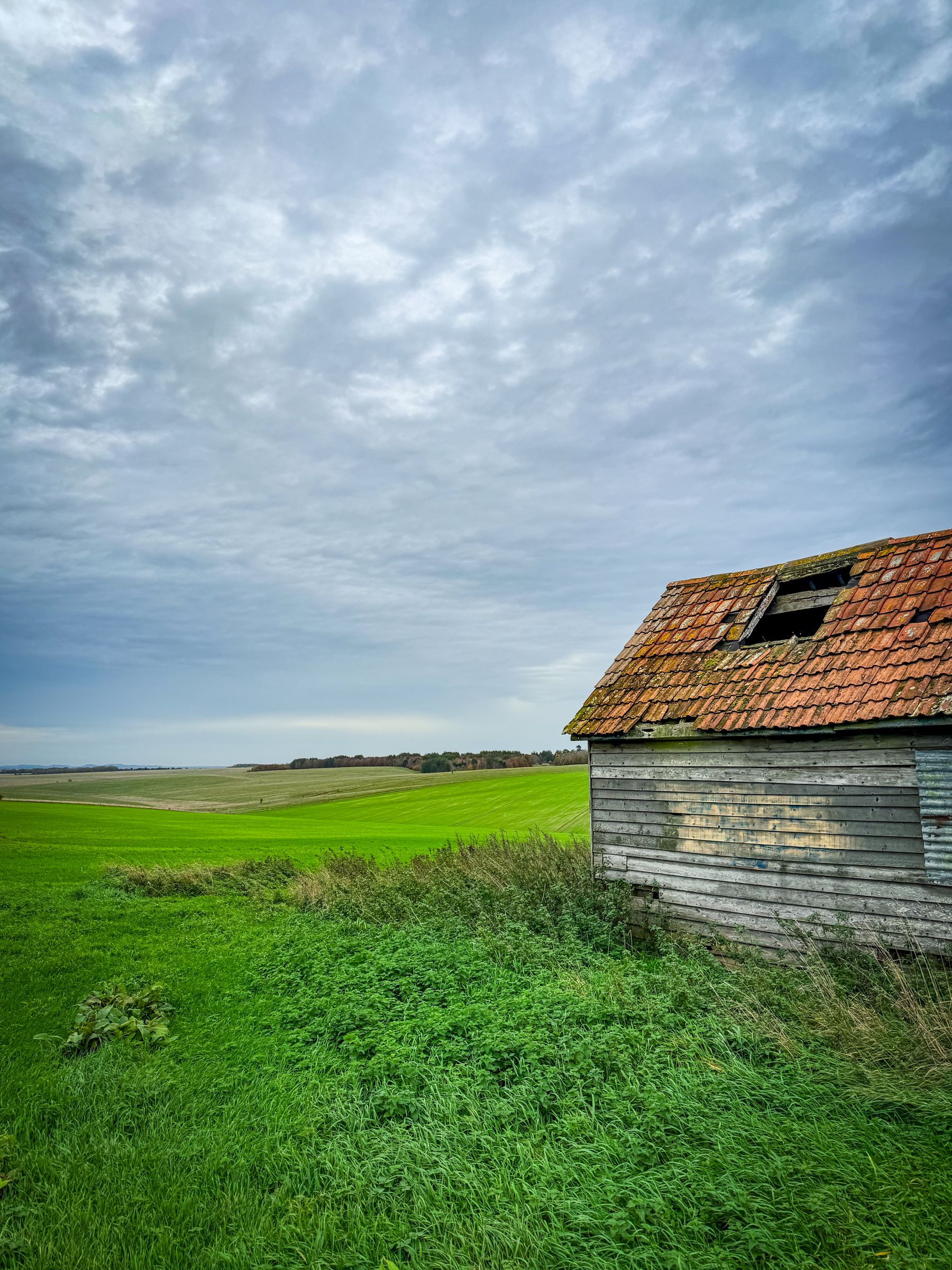 Historic barn in open fields
