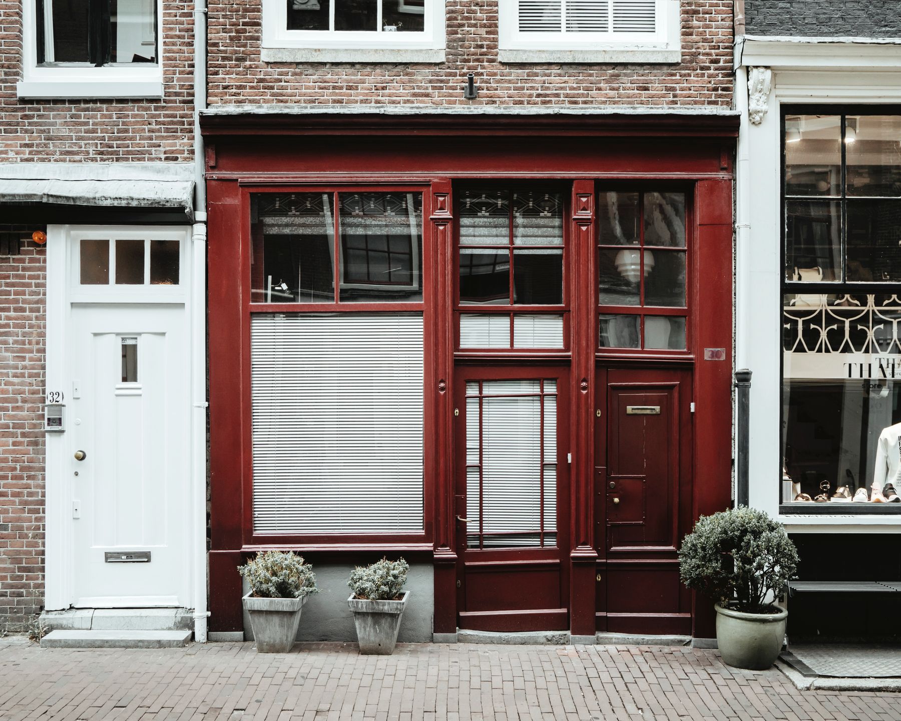 Red brick storefront on a quiet main street